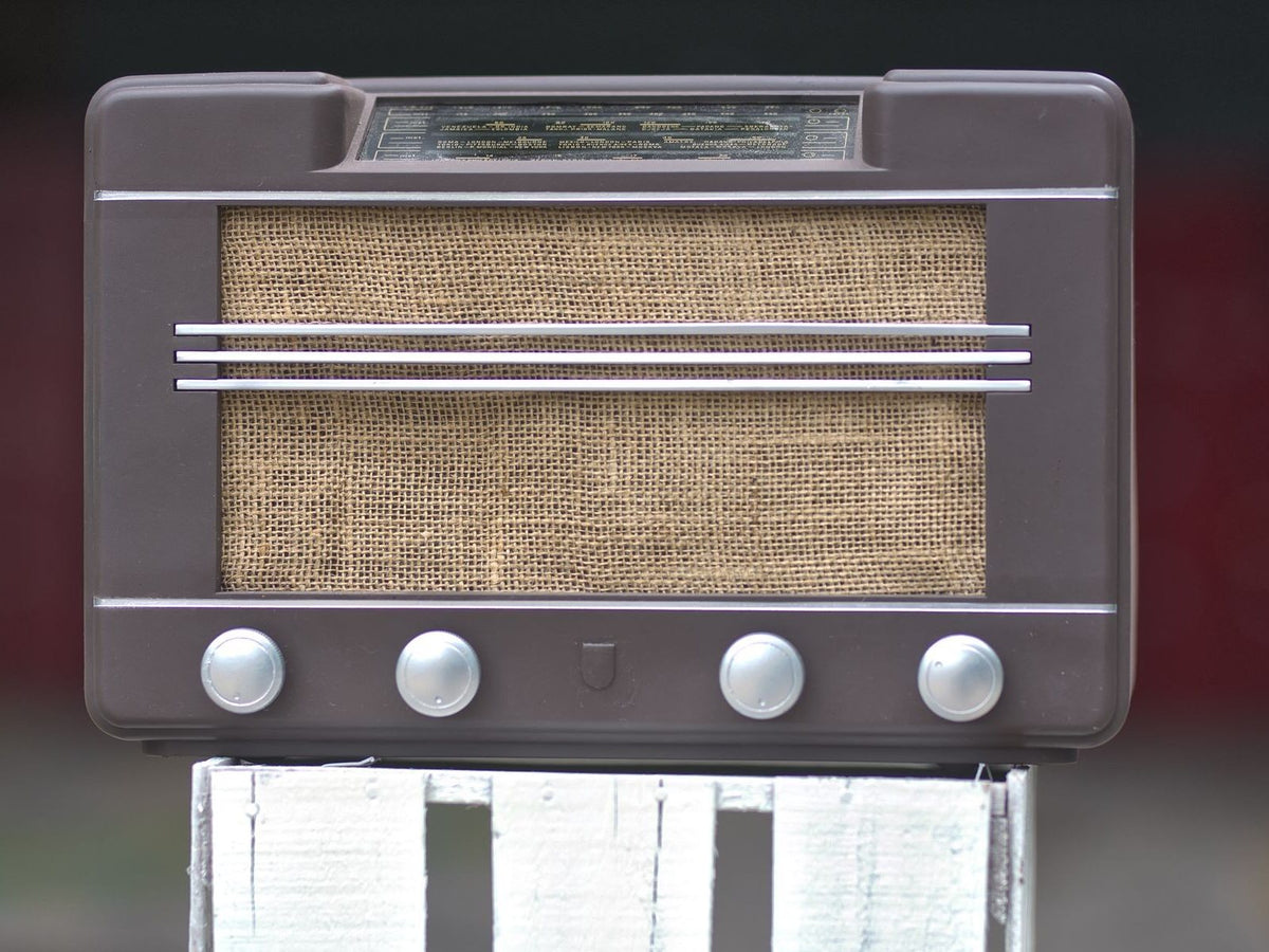 Close-up of a radio receiver with tuning dial and controls